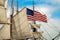 Majestic sailboat  with the United States flag sailing in the open waters