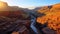 Majestic sandstone cliff, sunset over eroded rock generated by AI