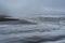 Majestic seacoast with wavy sea and cliffs, vik dyrholaey, reynisfjara beach, iceland