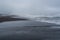 Majestic seacoast with wavy sea and cliffs, vik dyrholaey, reynisfjara beach, iceland