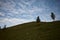 Majestic shot of a grassy hillside under a beautifully clouded sky