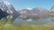 Majestic snowy Alps under blue cloudless sky, clear lake, vacation in mountains