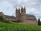 Majestic stone building nestled among a picturesque vineyard landscape