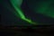 Majestic strong aurora borealis on autumn star filled night