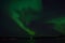 Majestic strong aurora borealis on autumn star filled night sky