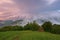 Majestic sunset in the mountains landscape. Overcast sky before storm. Carpathian, Romania, Europe