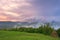 The Majestic sunset in the mountains landscape. Overcast sky before storm. Carpathian, Romania, Europe.