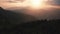 Majestic sunset or sunrise landscape in high mountains. Sunrise over mountain range silhouette