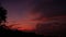 Majestic tropical purple summer timelapse sunset over sea with mountains silhouettes. Aerial view of dramatic twilight