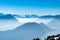 Majestic unique misty blue alpine skyline aerial view panorama of iced Swiss Alps and blue sky. Mount Rigi Switzerland.