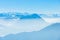 Majestic unique misty blue alpine skyline aerial view panorama of iced Swiss Alps and blue sky. Mount Rigi Switzerland.