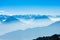 Majestic unique misty blue alpine skyline aerial view panorama of iced Swiss Alps and blue sky. Mount Rigi Switzerland.