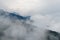 Majestic view on beautiful fog and cloud mountains in mist landscape