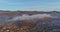 Majestic view of morning mountain village with covered fog