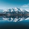Majestic view of snow mountains peaks reflecting in lake