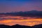 Majestic vivid sunset/sunrise with clouds over dark mountains