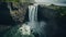 Majestic waterfall cascading over rugged rocks