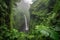 majestic waterfall, crashing into the misty abyss below, surrounded by lush greenery