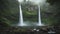 A majestic waterfall surrounded by mist and lush