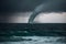 Majestic Waterspout Twisting Over Ocean Near Shore