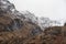 Majestic Winter landscape image of snowcapped Three Sisters mountain range in Glencoe Scottish Highands with dramatic sky