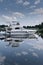 Majestic Yacht in a river on a sunny summer day with reflections