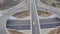 Major freeway view of traffic intersection, top view from drone of huge motorway through countryside