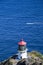 Makapuu Lighthouse on Ohau Island in Hawaii and passing boat