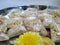 Makara Sankranti or Pongal Distribution Raw Sweet Packets arranged in a Steel Plate