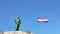 Makarska, Croatia. statue of St. Peter with a key symbol in his hands and the Croatian national flag