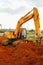 Makassar - June 10, 2022: Excavator operator digging the ground in the development project area at CPI Makassar