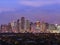 Makati, Metro Manila, Philippines - Early evening skyline of Makati and city lights. Wealthy low rise subdivision in