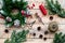 Make christmas wreath. Spruce branches, cones, threads, twine, sciccors on light wooden background top view