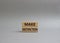 Make distinction symbol. Concept words make distinction on wooden blocks. Beautiful grey background. Business and make distinction