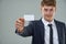 Make good business allies today. Cropped view of a young businessman holding a business card out towards you.