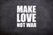 Make love not war white text and quotes with blackboard background.