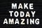 Make Today Amazing words on dark wooden background