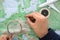 Make a travel plan by studying the map of Europe with a magnifying glass in hand