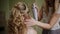 Make-up artist stiffens the bride`s hair. Professional makeup for woman with healthy young face skin-2