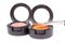 Make-up brush on orange eyeshadows in round boxes
