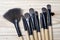 Make up brushes over wooden