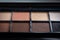 Make up palette. Eye shadow palette. Decorative cosmetics. Brown palette. Glamour visage. Professional cosmetics. Beauty concept.