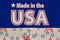 Make in the USA type message on blue fabric