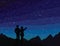 Make a wish. Silhouette of couple, watching falling star.