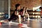 Make your commitment. Portrait of a boy smiling while warming up, exercising together with other kids and female trainer