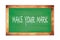 MAKE  YOUR  MARK text written on green school board