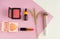 Makeup and accessories on a pink background. Makeup concept. Flatley
