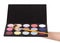 Makeup artist\'s hand holding palette eyeshadow isolated on white.