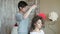 Makeup artist stylist works with model. hairdresser does the hair styling of the model. hair stylist creates a volume on