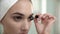Makeup At Bathroom. Woman Applying Mascara On Eyelashes